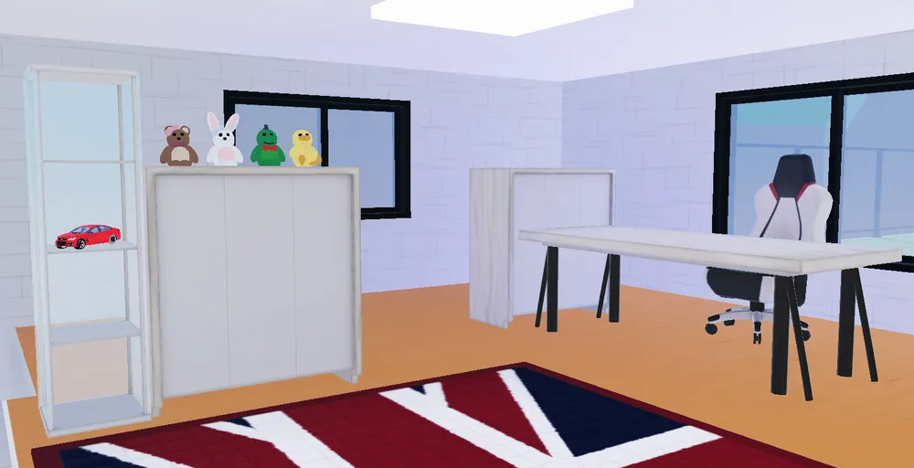 Euddeum’s room with a desk, gaming chair, and toys